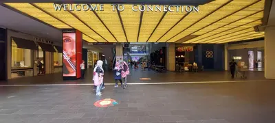 a group of people walking through a shopping mall at Plaza Berjaya Apt Bukit Bintang with Pool Table in Kuala Lumpur