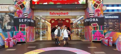 two people standing in front of a shopping mall at Plaza Berjaya Apt Bukit Bintang with Pool Table in Kuala Lumpur
