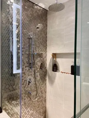 a shower with a glass door in a bathroom at Star Residence Apartment with twin towers KLCC view in Kuala Lumpur