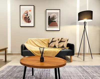 a living room with a couch and a table at KL Serenity Quarter Flexus at Jln Kuching - Self C-In, F-Parking in Kuala Lumpur