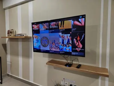 a flat screen tv hanging on a wall at KL Serenity Quarter Flexus at Jln Kuching - Self C-In, F-Parking in Kuala Lumpur