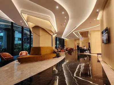 a lobby of a building with a fountain in the middle at The Axon Bukit Bintang by SMOVF BNB in Kuala Lumpur