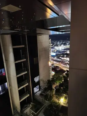 a view of a city at night from a building at M City Minimalist KLCC Suite in Kuala Lumpur
