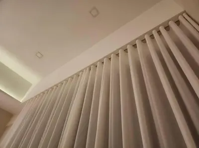 a room with beige curtains on a wall at M City Minimalist KLCC Suite in Kuala Lumpur