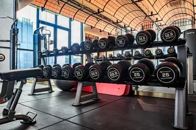 a gym with several rows of dumbbells on display at Scarletz Leisure Suites KLCC in Kuala Lumpur
