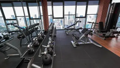 a gym with a bunch of treadmills and machines at Ceylonz Leisure Suites KLCC Bukit Bintang in Kuala Lumpur