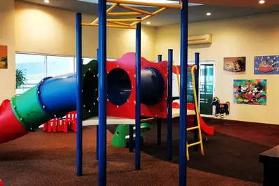 a play room with a playground with a slide at KLCC Luxurious 2 Floors Homestay 5BR for 15pax in Kuala Lumpur