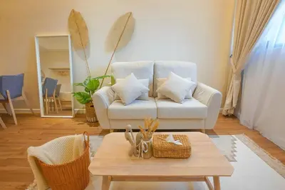 a living room with a couch and a coffee table at Chambers Suite Studio KLCC PWTC by Unimax in Kuala Lumpur