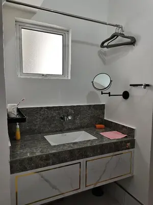 a bathroom with a sink and a mirror at Ampang Hilir Lake View in Kuala Lumpur