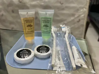 a tray with two bottles of cleaning products on a table at Chambers service suites klcc in Kuala Lumpur