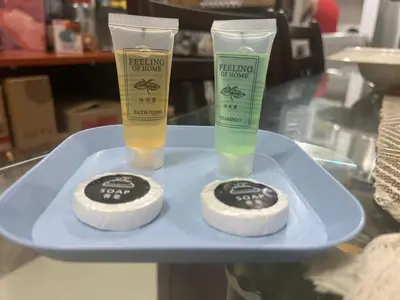 a blue tray with two bottles of cleaning products on it at Chambers service suites klcc in Kuala Lumpur