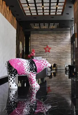 a room with a pink and white horse on display at Star residance KLCC-Two bedroom Apartment in Kuala Lumpur