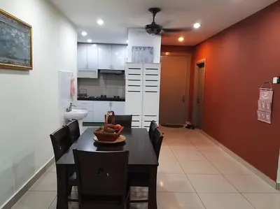 a kitchen with a table and chairs in a room at Zetapark, The Loft in Kuala Lumpur