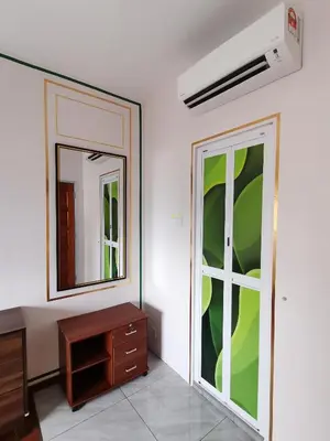 a dressing room with a mirror and a dresser at Ampang Hilir KL City Boutique Residence in Kuala Lumpur