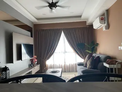 a living room with a couch and a window at M Centura Sentul in Kuala Lumpur