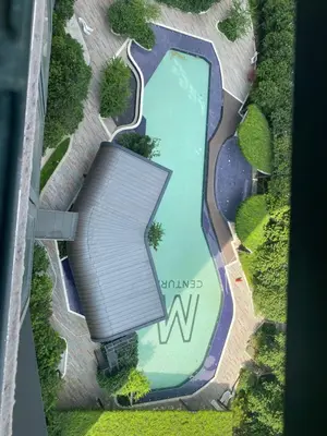 an overhead view of a swimming pool with a roof at M Centura Sentul in Kuala Lumpur