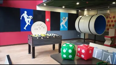 a room with a table and a clock and dice at The Harmony at Astoria Ampang - Mountain View in Kuala Lumpur