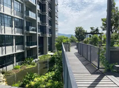 a boardwalk in the middle of a building at The Harmony at Astoria Ampang - Mountain View in Kuala Lumpur