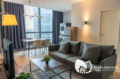 a living room with a couch and a table at Bangsar Trade Centre in Kuala Lumpur