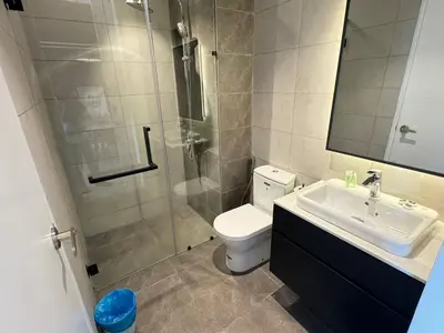 a bathroom with a shower and a toilet and a sink at AXON SUITE aT BUKIT BINTANG KL near Pavillion in Kuala Lumpur