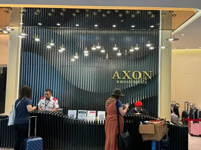 a group of people standing in front of a store at AXON SUITE aT BUKIT BINTANG KL near Pavillion in Kuala Lumpur