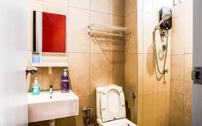 a small bathroom with a toilet and a sink at Platz @ KL North Setapak by Airhost in Kuala Lumpur