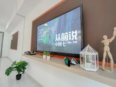 a flat screen tv sitting on a shelf in a living room at Plaza Berjaya By Manhattan Group in Kuala Lumpur