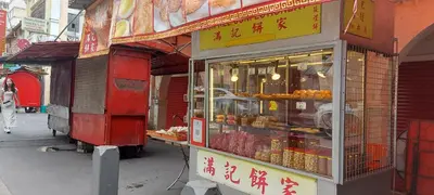 a food stand on the side of a street at Plaza Berjaya Apt Bukit Bintang With 3 Bedroom in Kuala Lumpur