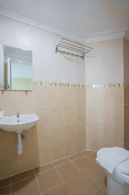 a bathroom with a sink and a toilet at Hotel 28 Titiwangsa in Kuala Lumpur