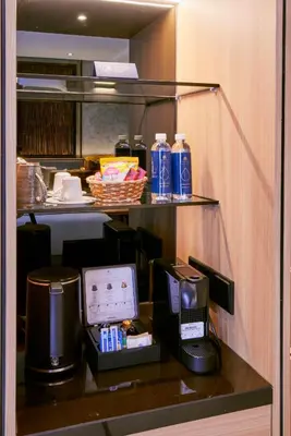 a hotel room with a coffee maker and a coffeemaker at Hotel Royal Signature in Kuala Lumpur