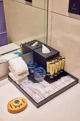 a box of towels on a table in a room at Hotel Royal Signature in Kuala Lumpur