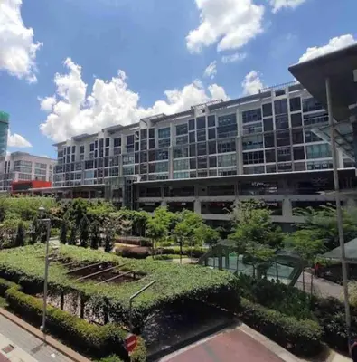 a large building with a garden in front of it at Sunway Velocity link velo mall Muji-2BR \u4e2d\u6587\u623f\u4e1c in Kuala Lumpur