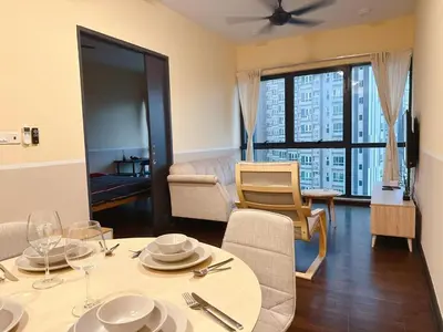 a living room with a dining table and a living room at Sunway Velocity link velo mall Muji-2BR \u4e2d\u6587\u623f\u4e1c in Kuala Lumpur