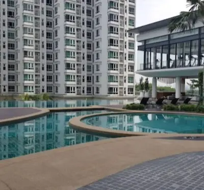 a building with a swimming pool in front of a building at Sunway Velocity Suite link velocity mall in Kuala Lumpur