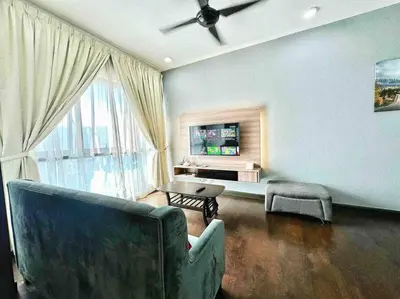 a living room with a couch and a table at Sunway Velocity Suite link velocity mall in Kuala Lumpur