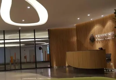 a lobby of a building with a sign on the wall at Sunway Velocity Suite link velocity mall in Kuala Lumpur