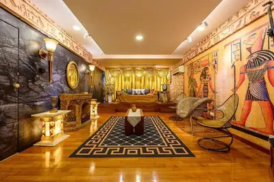 a living room with a couch and a fireplace at Fahrenheit88 - Egypt Theme Kuala Lumpur Bukit Bintang in Kuala Lumpur