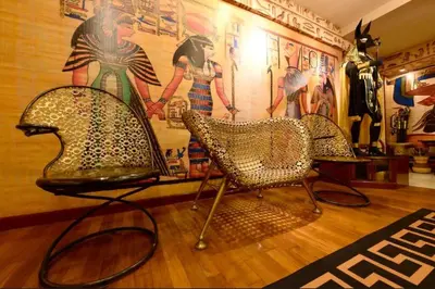 a room with two chairs and a wall with a mural at Fahrenheit88 - Egypt Theme Kuala Lumpur Bukit Bintang in Kuala Lumpur