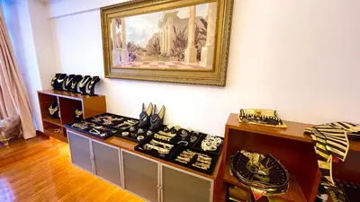 a room with a painting on the wall and a table with shoes at Fahrenheit88 - Egypt Theme Kuala Lumpur Bukit Bintang in Kuala Lumpur