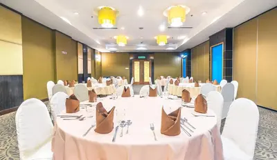a large banquet room with white tables and chairs at Crystal Crown Hotel Kuala Lumpur in Kuala Lumpur