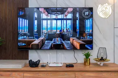 a television hanging on a wall with a bar at Luxury Duplex Condo Retreat-Corner v 2 Parking, KL by Verano in Kuala Lumpur