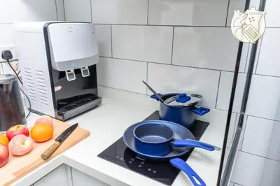 a kitchen counter with a frying pan on a stove at Luxury Duplex Condo Retreat-Corner v 2 Parking, KL by Verano in Kuala Lumpur