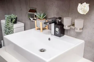 a white sink in a bathroom with plants on it at Luxury Duplex Condo Retreat-Corner v 2 Parking, KL by Verano in Kuala Lumpur