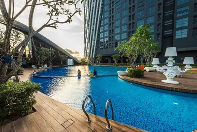 a large swimming pool in a city with buildings at Luxury Duplex Condo Retreat-Corner v 2 Parking, KL by Verano in Kuala Lumpur