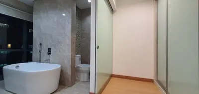 a bathroom with a white tub and a toilet at The Elements Ampang Infinity Pool in Kuala Lumpur