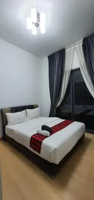 a large bed in a bedroom with a window at The Elements Ampang Infinity Pool in Kuala Lumpur