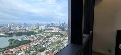 a view of a city from a window at Panoramic KLCC Lake view, M CITY Jalan Ampang in Kuala Lumpur