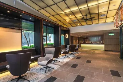 a waiting room with a row of chairs and windows at Ceylonz Suites KLCC, Bkt Bintang in Kuala Lumpur