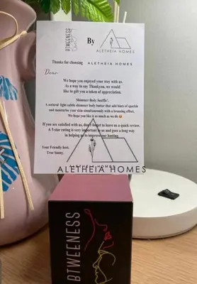 a box sitting on a table next to a vase at Aletheia Studio at KLCC in Kuala Lumpur