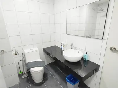 a white bathroom with a sink and a toilet at Chambers Service Suites Amazing View KLCC in Kuala Lumpur